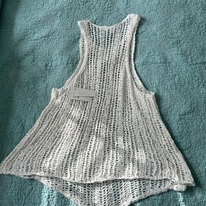 White sleeveless crocheted sweater top